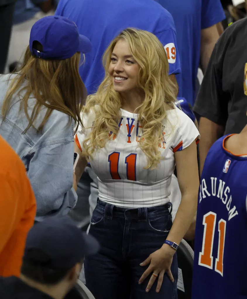 Sydney Sweeney Stuns Courtside in a Custom Brunson Jersey at NBA Finals Game 5x - Jason Szenes for the New York Post