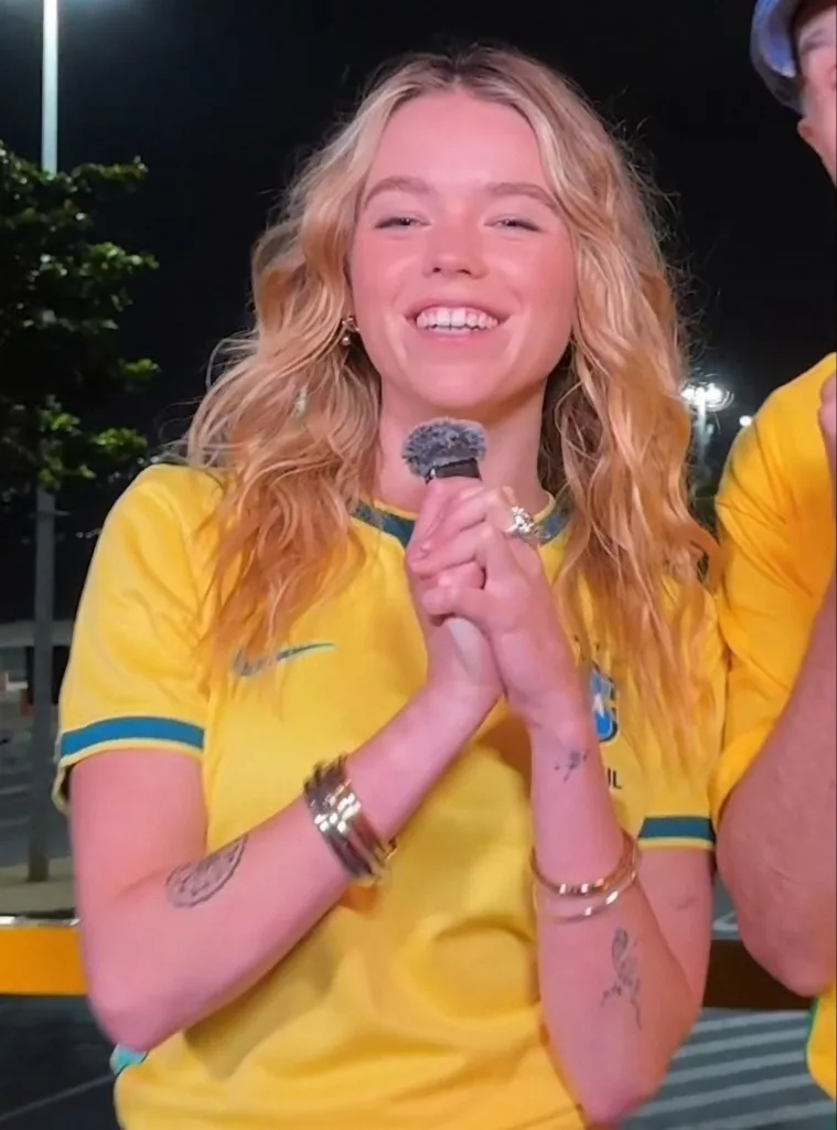 Milly Alcock Goes Full Brazil in a Yellow Jersey at a World Cup Watch Party - Warner Bros. Pictures / DC Studios